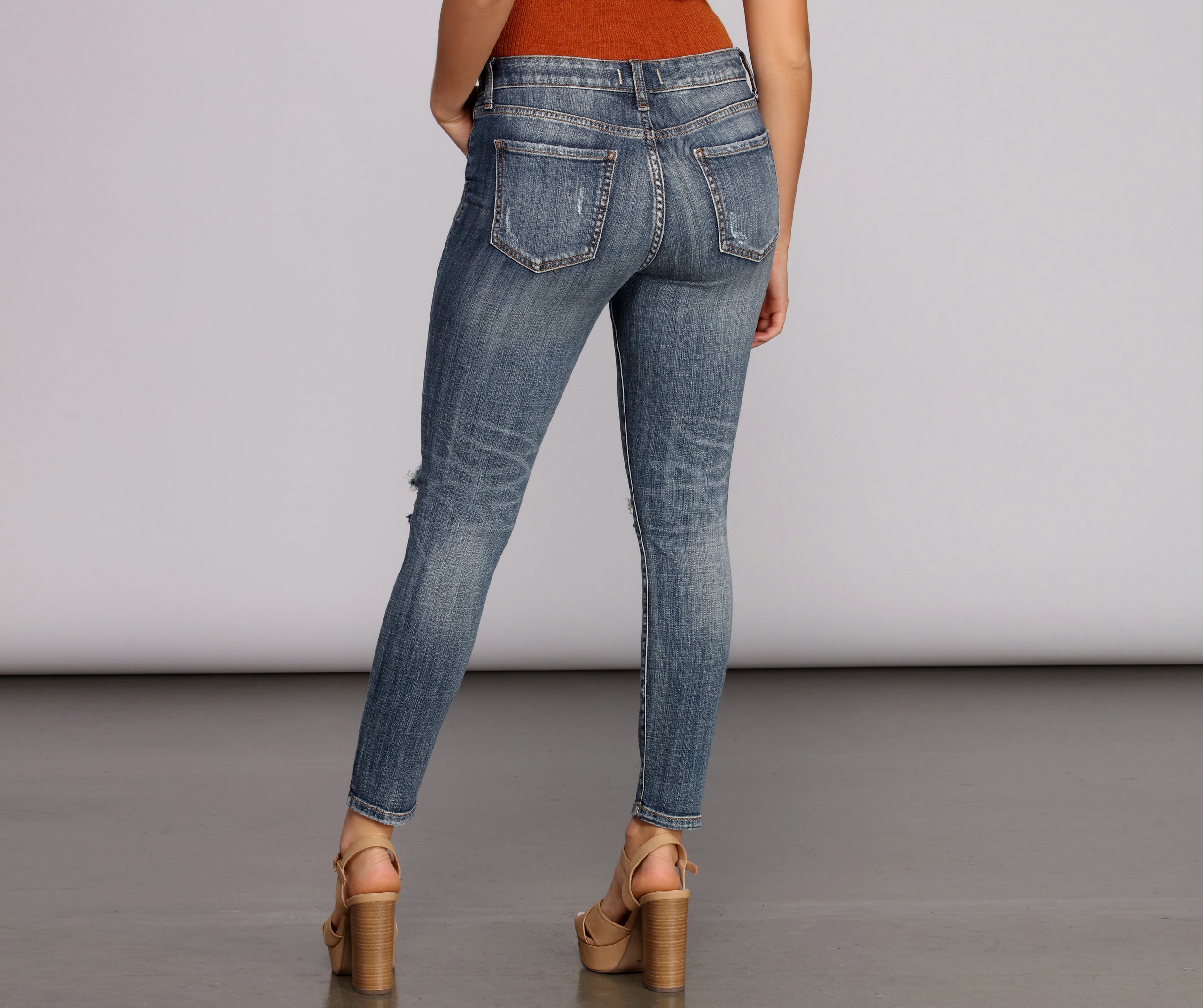 Josie Mid Rise Destructed Skinny Jeans