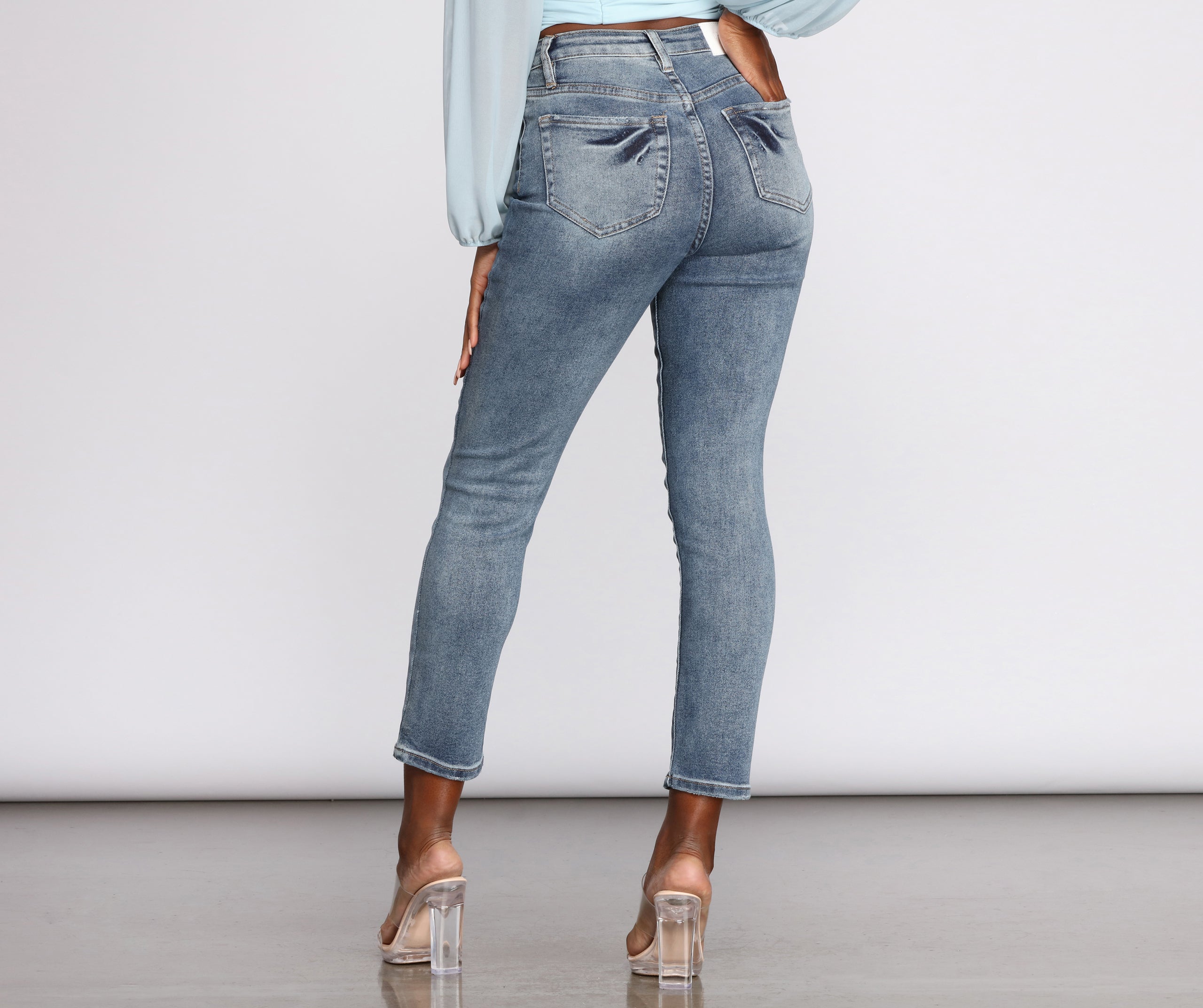 High Rise Distressed Tapered Jeans